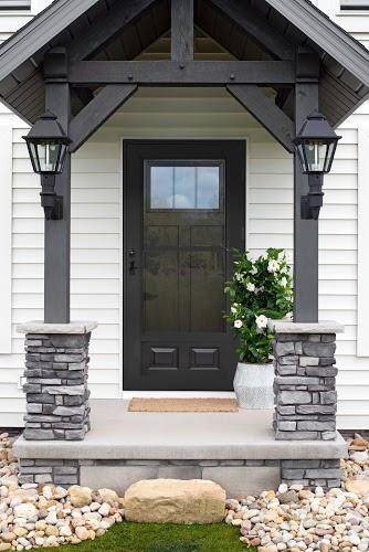 storm door paired with wooden entry door