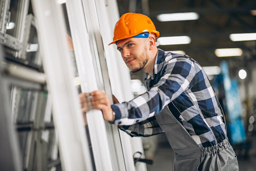 construction worker moving window frame