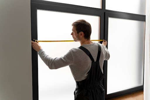 man-installing-privacy-glass.jpg